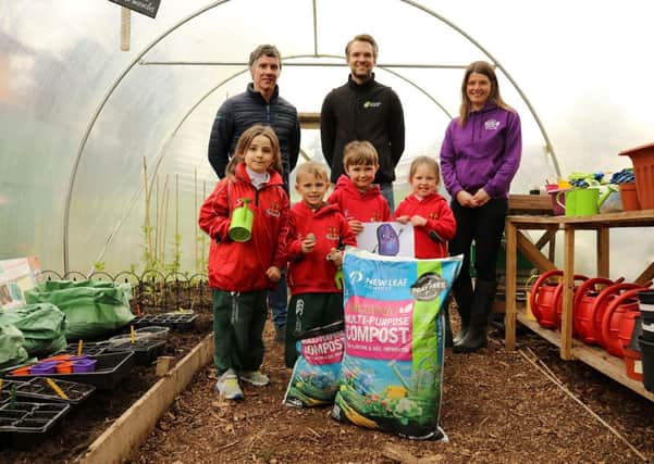 Primary 1 pupils from Friends’ Prep school in Lisburn help to launch the ‘Purple Potato Project’ an initiative set up by Lisburn-based social enterprise Kinder Garden Cooks which has joined with organics recycling firm Natural World Products (NWP) and Patch Seed Potatoes to encourage kids to ‘get growing’.  They are joined by, from left, Colm Warren of NWP, Alex McCreight of Patch Seed Potatoes and Sharon McMaster of Kinder Garden Cooks. The scheme will see 280 pupils across the Lisburn  area receive a bag of New Leaf Compost from NWP, which converts local household food and garden waste into organic, peat-free compost, and a newly-bred purple seed potato from Patch Seed Potatoes. The Purple Potato character is designed by artist Corrina Askin. Photography by Jude Rankin