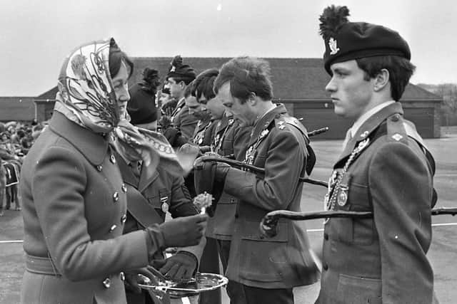 Mrs J N Lefroy, wife of the commanding officer, got a cheer, below, after she presented shamrock sprigs to Royal Irish Rangers officers at their Ballymena depot in March 1982. Above, the regiment's deputy colonel, Col R C Rothery, took at the salute from ex-servicemen at the depot. Pictures: Trevor Dickson/News Letter archives