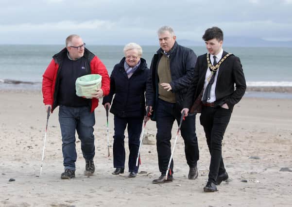 REPRO FREE  07/03/20 Northern Ireland Secretary of State Brandon Lewis, Mayor of Causeway Coast and Glens Sean Bateson Declan Donnelly and Brenda Caher joined volunteers on Ballycastle beach on Saturday morning to partake in the Beach Bucket Challenge, learning more about, and offering his support for the local environmental partnership initiative tackling marine pollution. Pic Steven McAuley/McAuley Multimedia