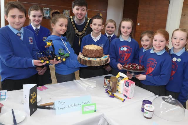 The Mayor of Causeway Coast and Glens Borough Council Councillor Sean Bateson pictured with pupils from Macosquin Primary School, Garryduff Primary School and Harpur's Hill Primary School at the Fairtrade Bake-Off celebration event in Cloonavin.