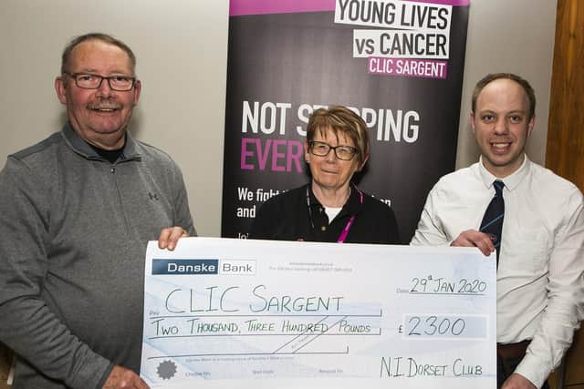 Michael Maybin (President) and Allister McNeill (Chairman) make the cheque presentation to Mrs Valerie Cubitt from Clik Sargent.