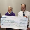 Michael Maybin (President) and Allister McNeill (Chairman) present the cheque to Mrs Rosemary Moore from The Childrens Hospice.