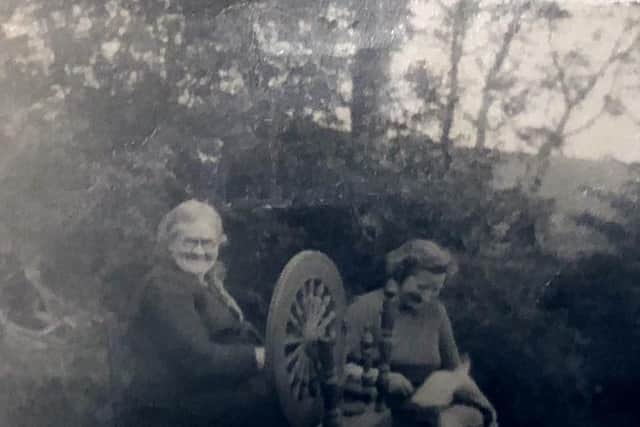 a picture showing two women at an old spinning wheel, date unknown. The women in the picture are Mrs Mary Jane Conway (nee Cullinan) and Mrs Bridget Duffy (nee Conway) and they are mother and daughter. They are the great grandmother and great aunt of Farming Lifes Darryl Armitage. They are pictured at the Conways family home in the Sperrin Mountains, Co Tyrone, at a place called Oughtdoorish, Cranagh. The family were self sufficient and lived miles into the hills at Sawel Mountain. Darryls mother remembers her grandmother was an expert at making butter