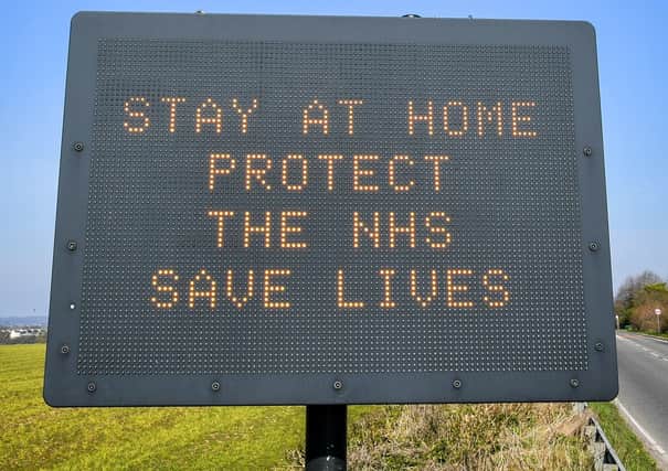 A matrix road sign on the A367 into Bath advises motorists to stay at home to protect the NHS and save lives the day after Prime Minister Boris Johnson put the UK in lockdown to help curb the spread of the coronavirus. PA Photo. Picture date: Tuesday March 24, 2020. See PA story HEALTH Coronavirus. Photo credit should read: Ben Birchall/PA Wire