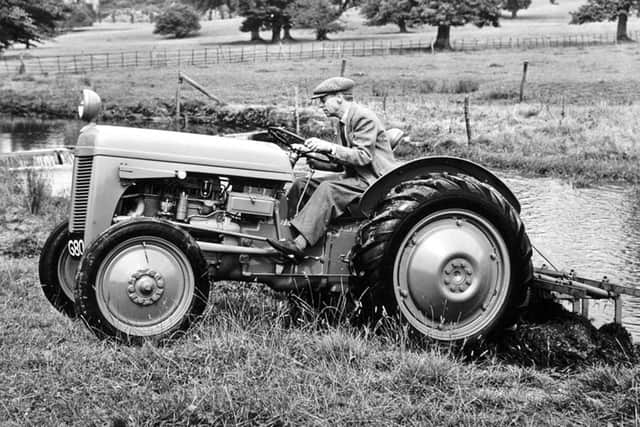 Pictured at his Cotswold home, Abbotswood, Harry Ferguson is shown driving a TE-20.