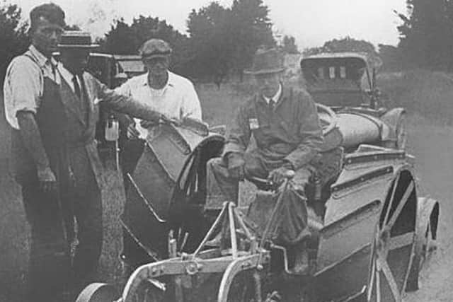 Harry Ferguson on tractor demonstrating his plough in the USA in 1922