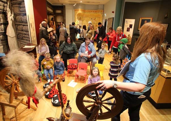 Esther from the Irish Linen Centre and Lisburn Museum storytelling round a spinning wheel. Picture: Irish Linen Centre and Lisburn Museum