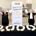 JCB's Louise Fresson, of Caverswall, Stoke-on-Trent, (left) and Hannah Clendon, of Little Haywood, near Stafford, help mark the production of JCB's 10,000th meal for vulnerable people living in the communities around its Staffordshire factories