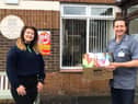 Club member Emma Millar pictured with Roddens Residential home manager Philip Dawson when receiving their stress relief kits