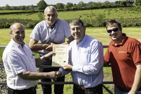 CAFRE Agricultural Business Operations (Level II) course manager Kenneth Johnston congratulates William Dennison from Antrim on achieving his Level II Agriculture Business Operations certificate in March 2018. Looking on are William’s son James and brother Stirling. The image was taken prior to the introduction of social distancing guidance