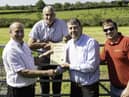 CAFRE Agricultural Business Operations (Level II) course manager Kenneth Johnston congratulates William Dennison from Antrim on achieving his Level II Agriculture Business Operations certificate in March 2018. Looking on are William’s son James and brother Stirling. The image was taken prior to the introduction of social distancing guidance