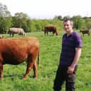 Douglas McKenzie pictured with some of his replacement heifers.