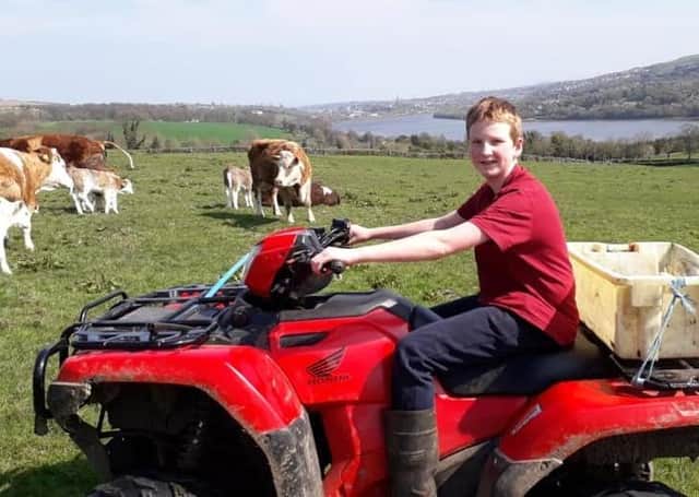 Andrew Mackey out on the quad checking the cows