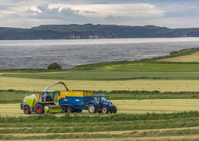 Ballycastle. Northern Ireland. 06.22.16. Agriculture - collecting silage in the fields near Ballycastle in County Antrim, Northern Ireland. Silage is grass fodder that is used as animal feed during the winter.