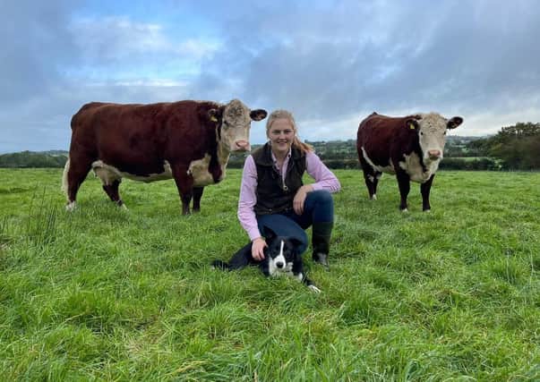 Ellen pictured with her dog Ed and Hereford cattle