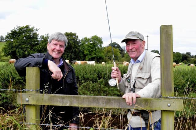 Raymond McMaster and Joe Mahon on the banks of the Quiggery Water.