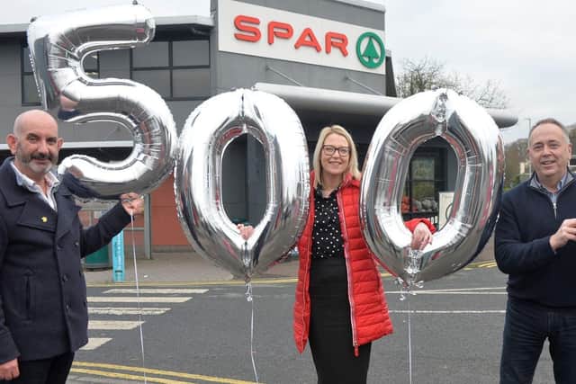 Conor O’Kane (left), Senior Partnership Manager with Marie Curie joins Lynsey Evans from Henderson Group and retailer, Peter McBride to celebrate SPAR NI retailers’ raising over £500,000 for Marie Curie since the partnership began in 2017. The half a million has gone towards a huge UK-wide total of £2,000,000 announced this week.
