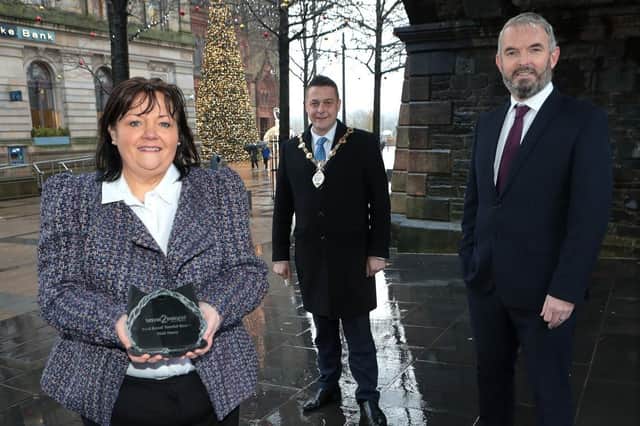 Mayor of Derry City and Strabane District Council, Alderman Graham Warke joins Visit Derry’s Chairperson Michelle Simpson and Chief Executive Odhran Dunne to celebrate the organisations recent award as Best Local Tourist Board.