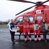 Countryside Services staff announce Air Ambulance NI as their joint charity partner for 2022 - from left to right: Field Sales Representative Geraldine McElduff, Air Ambulance NI HEMS consultant doctor Dr Ciaran Mc Kenna and Air Ambulance NI HEMS paramedic Mike Patton, Shannon Grogan, Marketing Executive and Ciaran Duffy, Countryside Services.