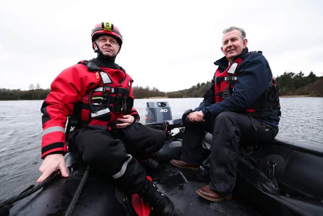 Lagan Search and Rescue volunteer John Russell and DAERA Minister Edwin Poots on the lake at Hillsborough Forest Park.