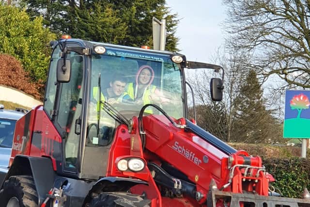 Ryan McKnight and Holly Hamilton, members of Hillhall Young Farmers ensuring everyone got back to Danescroft