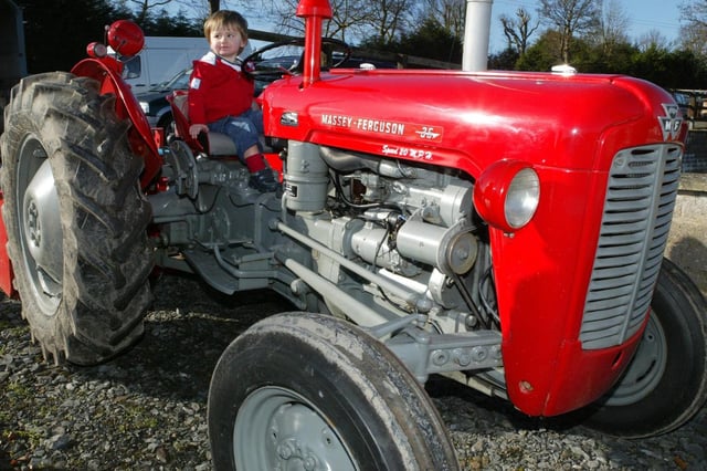 Two-year-old Patrick Leach from Dromore at the Massey Ferguson 35 at the Glenavy and District Old Car Rally in March 2007. Photo: Colm O'Reilly / Ulster Star Archive