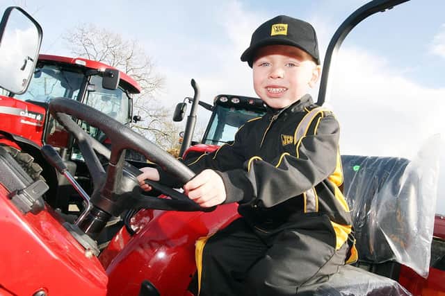 Four-year-old Thomas McAreevey pictured on a Massey Ferguson tractor at the Glenavy Vintage Club Rally which was held in March 2007. Picture: Colm O’Reilly/Ulster Star archives
