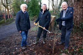 DAERA Minister Edwin Poots is pictured planting a tree at Redburn Country Park with Sir Robin Masefield and Dr Bill Lockhart from Holywood Shared Town.