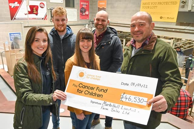 Amy Muldrew, Jamie Hewitt and Louise Hill present Cancer Fund for Children’s CEO, Phil Alexander and former Ulster and Ireland Rugby caption, Rory Best with a cheque for £46,530. The funds were raised through a Christmas Charity Show & Sale which was held in memory of one year old Theo Hill who passed away in October 2021.