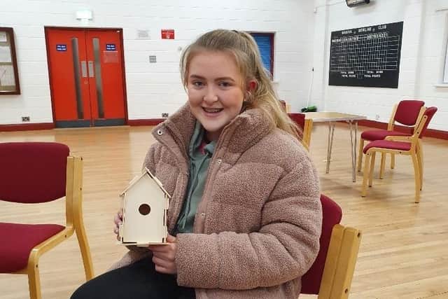 Club member Laura Bartley presenting her bird house which was made at the Mourne YFC eco awareness night