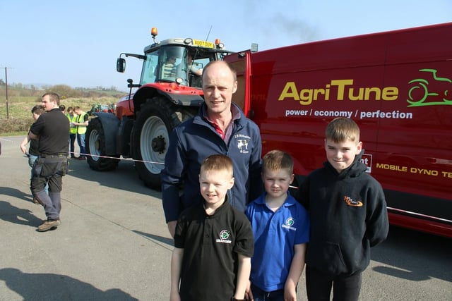 John McGaffin with children Ruben, Scott, and Stuart enjoying the big tractor run