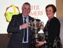 BT cup winner Dr. Christine Kennedy being presented with the trophy by UFU president Victor Chestnutt.