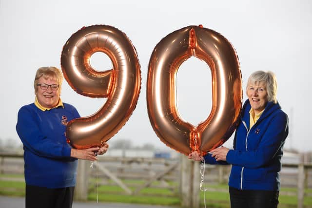 Kathleen Verner, WI Federation Vice Chairman and Heather Adamson, WI Balmoral Show Sub Committee Chairman, celebrate the WI’s 90th Anniversary and their return to Balmoral Show 2022.