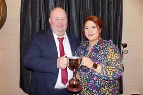 Robert Matthewson,  of Newtownstewart YFC, kindly presents a brand new cup to Tyrone YFC, ‘The Matthewson Cup’ for ‘Club’s Club’. Receiving the trophy on behalf of Tyrone YFC is Shannen Vance, county chair, The new trophy was won by Castlecaulfied YFC.
