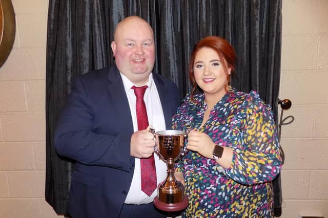 Robert Matthewson,  of Newtownstewart YFC, kindly presents a brand new cup to Tyrone YFC, ‘The Matthewson Cup’ for ‘Club’s Club’. Receiving the trophy on behalf of Tyrone YFC is Shannen Vance, county chair, The new trophy was won by Castlecaulfied YFC.