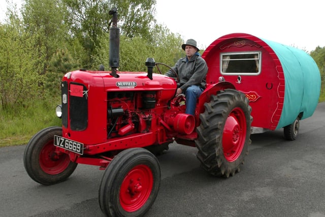 Edwin Wylie from Cookstown with his 1960 Nuffield Tractor and trailer in the Blossom Vintage Tractor Run from Peatlands Park in 2006. Pic Bernie Brown