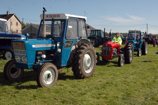 Tractors head for the Banbridge town centre for the Corbet tractor run held in aid of Macmillan in 2006.