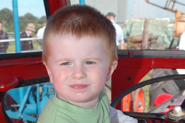 Luke Walker has his lunch at the Corbet tractor run in his families Massey Fergusson 35 back in 2006.