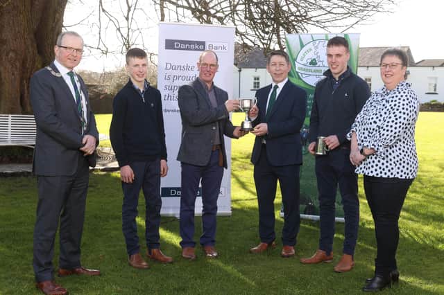 Gordon Mitchell and family from Banbridge receive the Runner Up Awards in the UGS Grassland Farmer of the Year competition from Rodney Brown, Head of Agribusiness, Danske Bank and Harold Johnston, President, Ulster Grassland Society