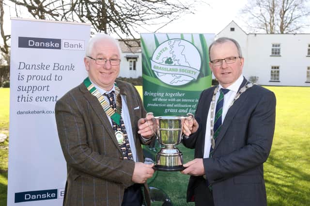 British Grassland Society President Drew McConnell presenting the BGS Cup to Harold Johnston marking their success in last years UGS Grassland Farmer of the Year competition