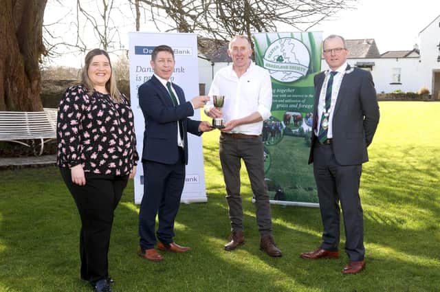 John Milligan from Castlewellan receiving his award in the Grassland Farmer of the Year competition from Rodney Brown, Head of Agribusiness, Danske Bank watch by Carol McMullan, Danske Bank and Harold Johnston, UGS