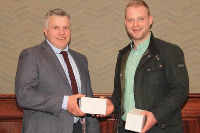 Guest speaker Andrew Neilson, Overside Herd, Lanarkshire, receives a token of appredication from newly elected chairman Alex Walker, at Holstein NIâ€TMs 22nd AGM, held in Antrim. Picture: Julie Hazelton