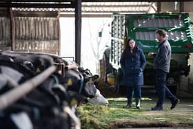 East Londonderry Assembly candidate Claire Sugden speaks with Portrush dairy farmer William Chestnutt during a recent visit