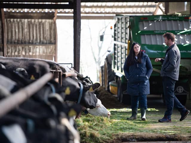 East Londonderry Assembly candidate Claire Sugden speaks with Portrush dairy farmer William Chestnutt during a recent visit