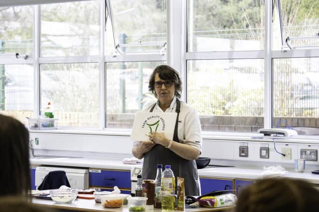 LMC cookery demonstrator Hilary Stevenson speaks about the NIFQA logo during a demonstration at Newtownhamilton High School