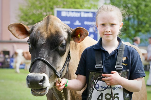 Jane Leader, from Crumlin, walks her Jersey cow into the show ring at Balmoral Show 2010. Picture: Cliff Donaldson