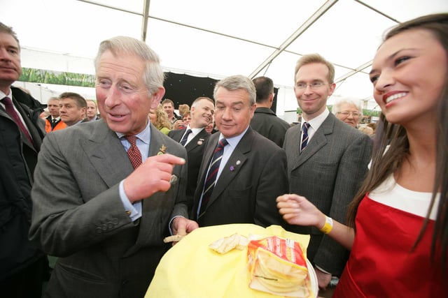 ROYAL SEAL OF APPROVAL... Prince Charles gives local bread brand the royal seal of approval as he samples a Sunblest pancake from Ciara McStravick during his visit to the Good Food NI Pavilion at the Balmoral Show 2010.