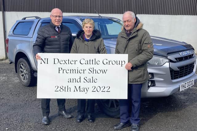 Peter Eakin from Eakin Bros. Motors discussing final plans for NI Dexter Cattle Group Premier Show and sale with judges Deirdre and Howard Hilton.