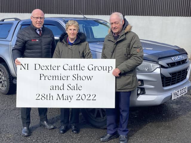 Peter Eakin from Eakin Bros. Motors discussing final plans for NI Dexter Cattle Group Premier Show and sale with judges Deirdre and Howard Hilton.