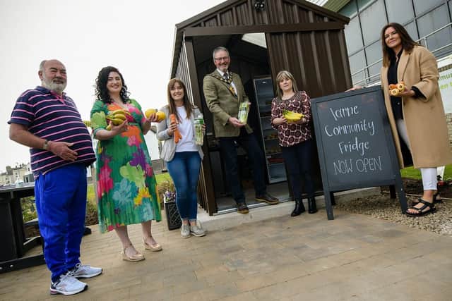 Left to right: Mervyn Blair (incrEDIBLE garden project volunteer), Lynsey Poole (Chairperson of Larne Area Community Support Group), Rachel Maybin (community fridge volunteer), Mayor, Alison Nel (Larne Area Community Support Group member), Sharon Smith (Extern Larne manager)